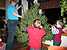 Connor and Bryn help Mom decorate the tree.