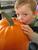We had to cut up this pumpkin from our back yard to make pies for Thanksgiving.  Bryn is kissing it goodbye!